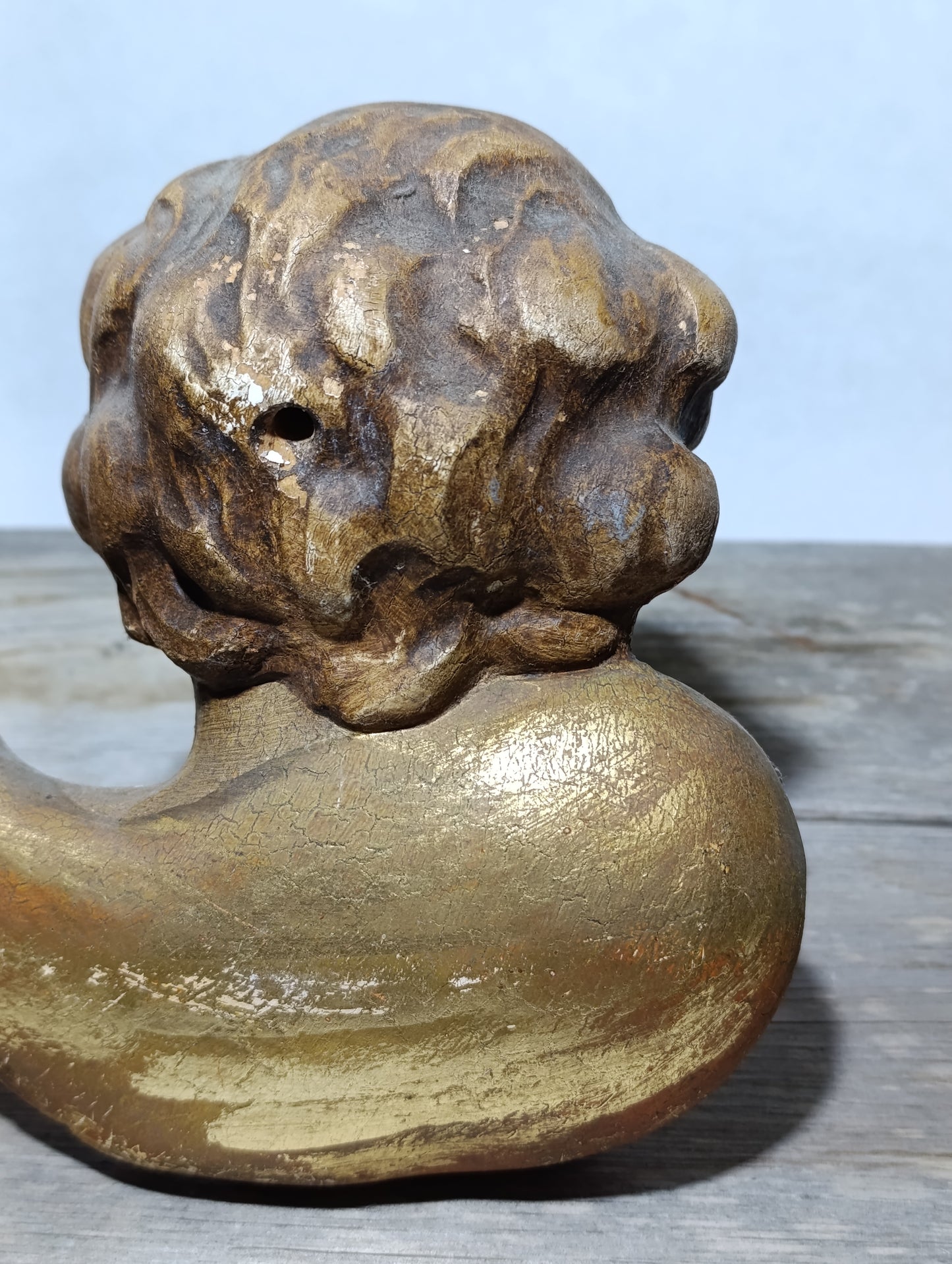 Cabeza de querubín en madera policromada